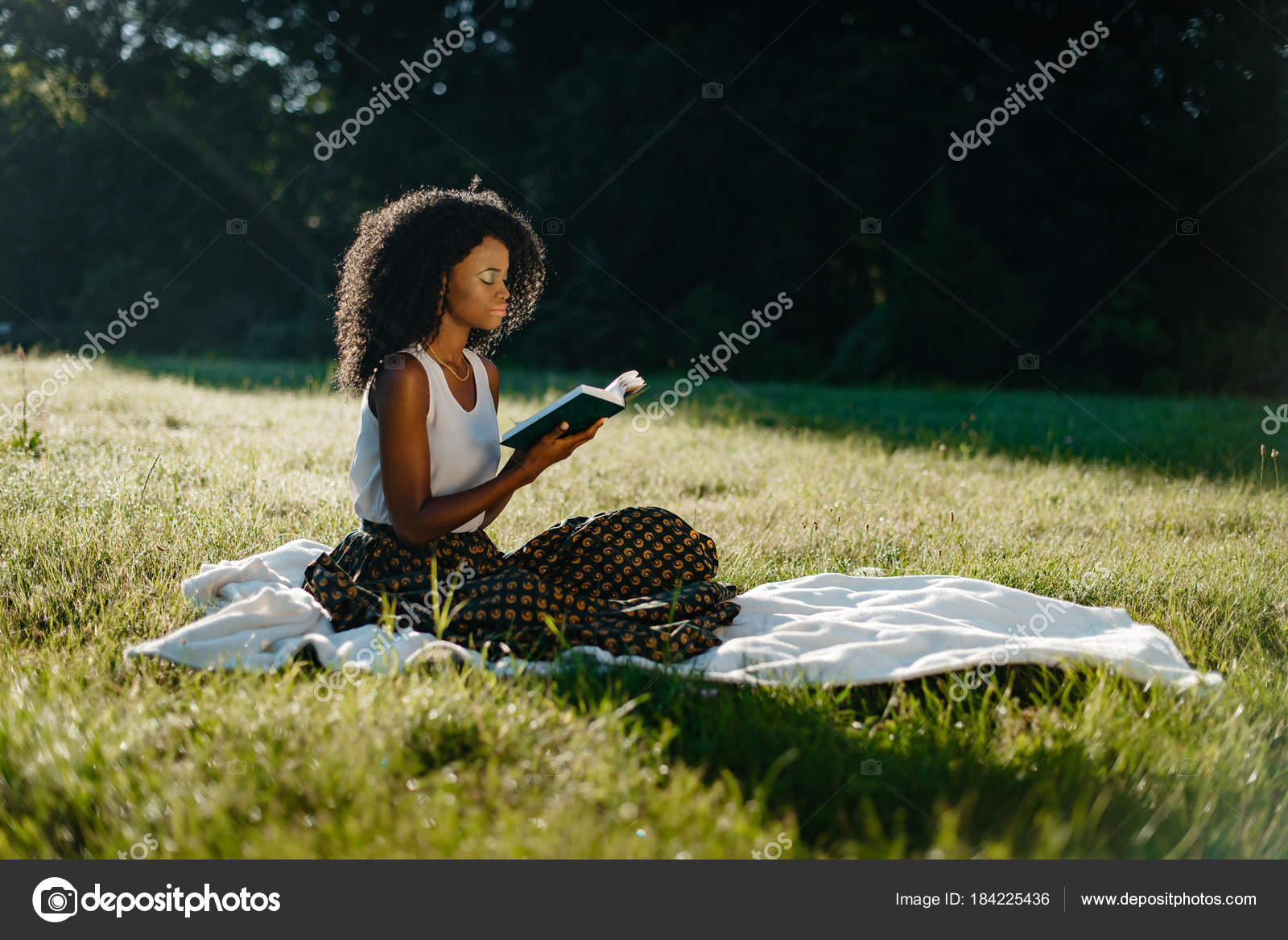 Charming African Girl With Natural Make Up And Curly Hair Is