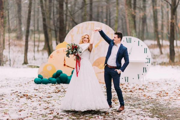 Beautiful wedding couple dances in the autumn forest