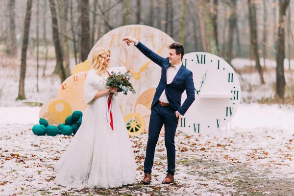 Beautiful wedding couple dances in the autumn forest
