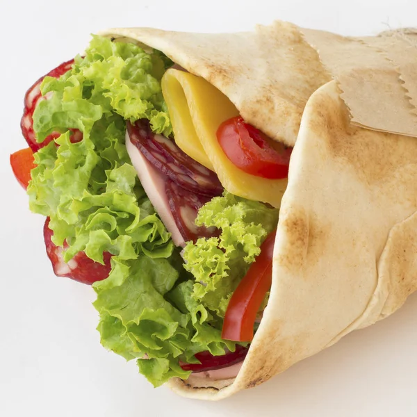 Roll tortilla with herbs, cheese and meat on a white background — Stock Photo, Image