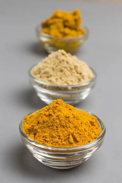Herbal therapy concept. Spice set: ginger and turmeric powder,