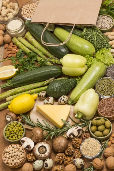 Set of healthy food: cheese leafy vegetables, beans nuts, quinoa bulgur, chickpeas, flax almond. Alkaline foods. Sources of omega 3. top view.