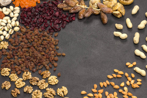 Dry fruit, nut, candied fruit. Energy nutritious mix. Natural source for immunity boosting. Copy space. Black background