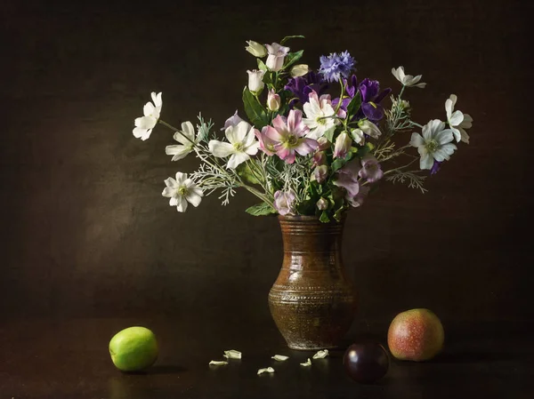 rustic still life of fruit and flowers