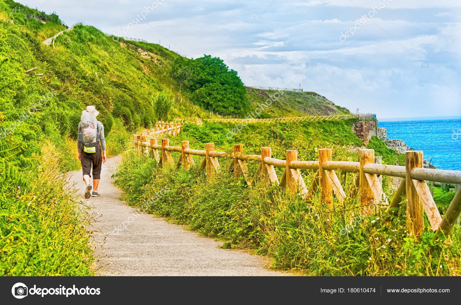Lonely Pilgrim with backpack walking the Camino de Santiago in