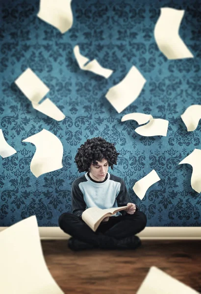 Young guy reading a book