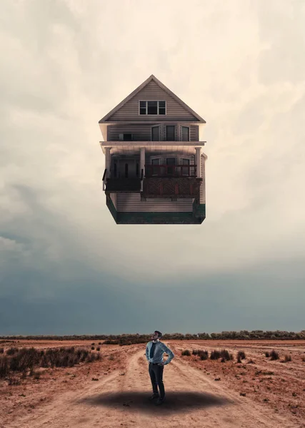 Huis opstijgen vanaf de grond naar de hemel — Stockfoto