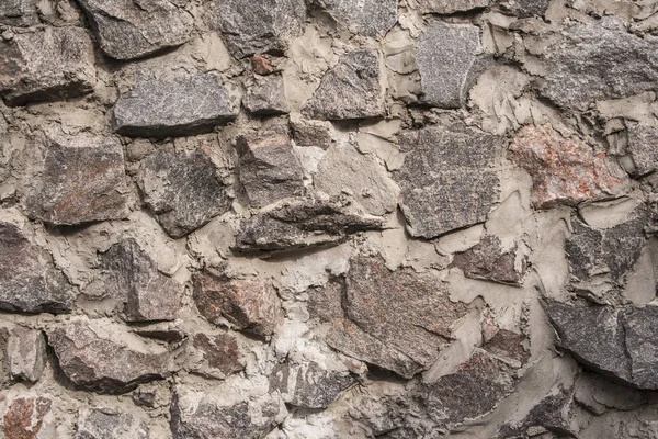 Muur van steen close-up als achtergrond — Stockfoto