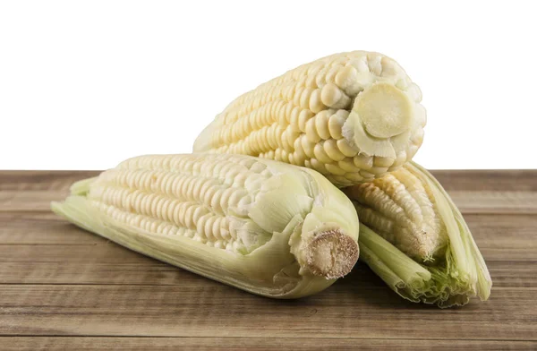 Corn cobs on a wooden table — Stock Photo, Image