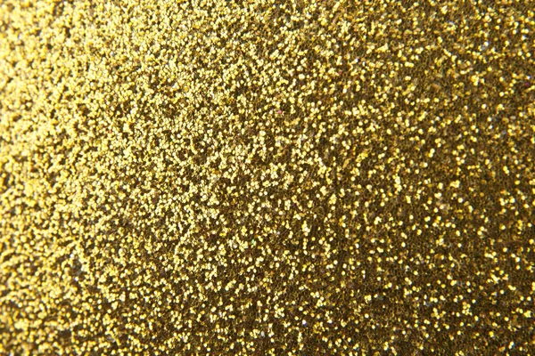 Textur eines goldglänzenden Hintergrundes für festliche Dekorationen — Stockfoto