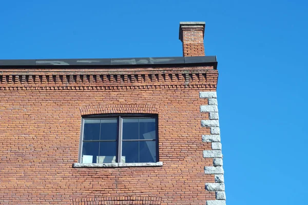 vintage building red brick office downtown old city architecture business chimney and window detail