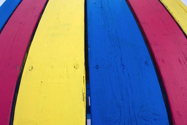 Multicolor painted wood table red yellow blue texture — Stock Photo, Image