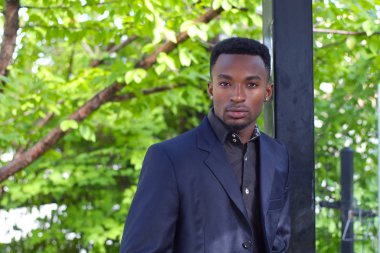 office worker in black suit young businessman outside