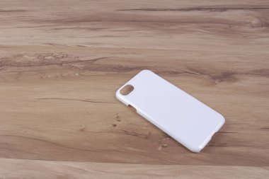 Ahşap arka plan akıllı telefon için durum