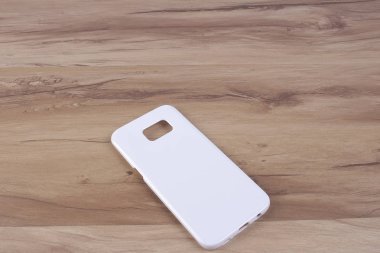 Ahşap arka plan akıllı telefon için durum