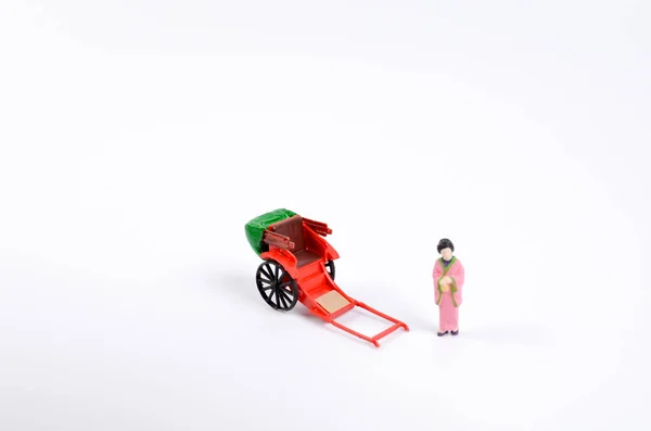 De figuur van kimono met voertuig — Stockfoto