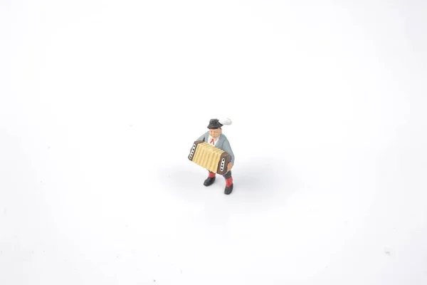 Figura jugador de Accordian del mundo en miniatura — Foto de Stock