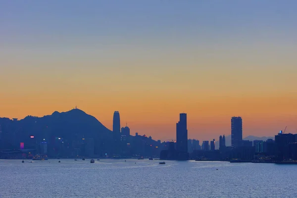 A naplemente a Hong Kong-ban kikötő — Stock Fotó