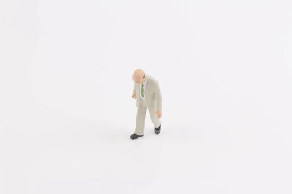 Pessoas em miniatura no fundo branco — Fotografia de Stock