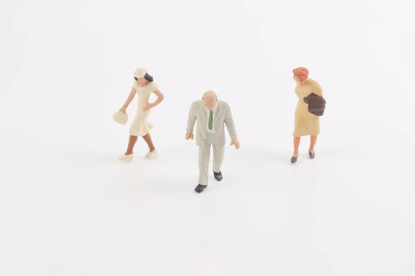 Personas en miniatura en el tablero — Foto de Stock