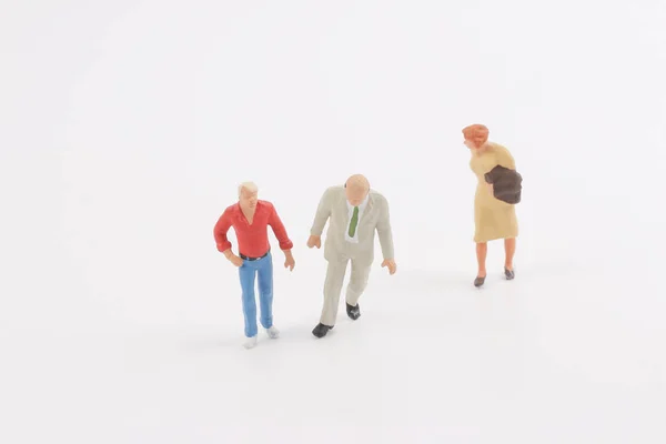 Personas en miniatura en el tablero — Foto de Stock