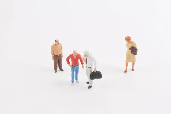 Personas en miniatura en el tablero — Foto de Stock