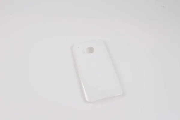 Kotak plastik untuk telepon pintar pada latar belakang putih — Stok Foto