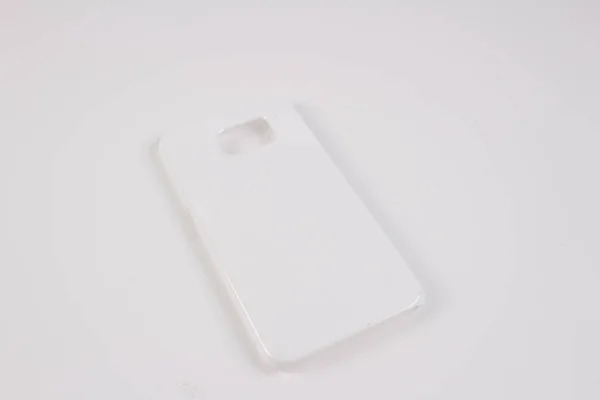 Caixa de plástico para telefone inteligente no fundo branco — Fotografia de Stock