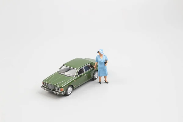 tiny small business figure with car