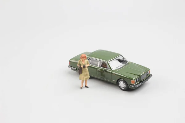 tiny small business figure with car