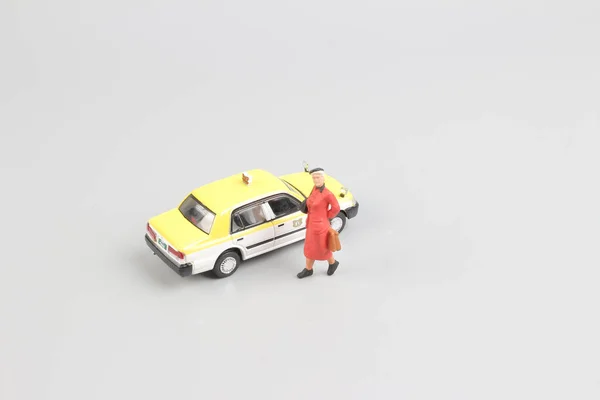 Μικροσκοπικό παιχνίδι ταξί με το σχήμα του ταξιδιώτη — Φωτογραφία Αρχείου