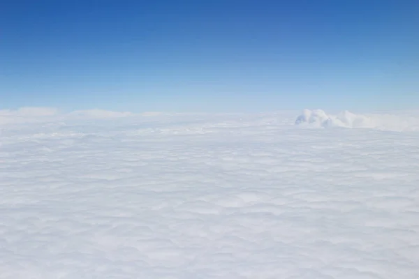 Blue sky high view from airplane clouds shapes — Stock Photo, Image