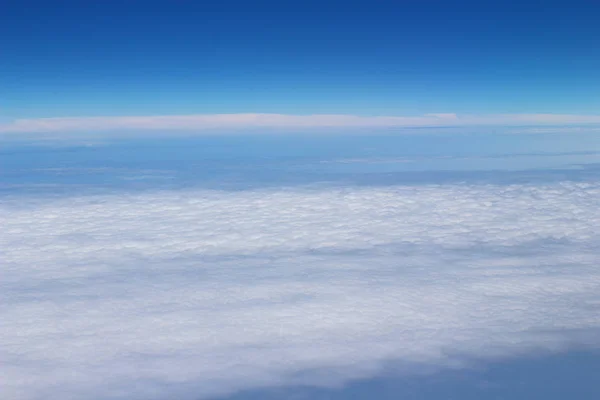 Blue sky high view from airplane clouds shapes — Stock Photo, Image