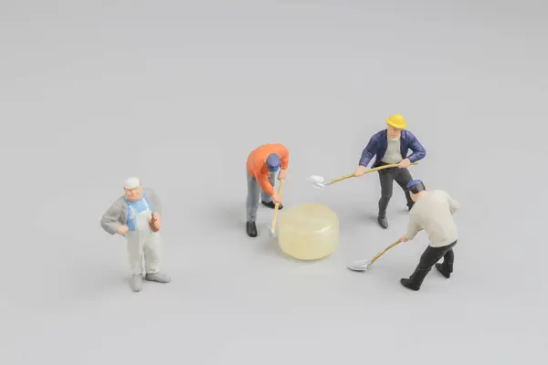 Mini of painters of workers with candy — Stock Photo, Image