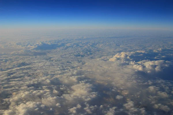 View of jet plane wing with cloud patterns — Stock Photo, Image