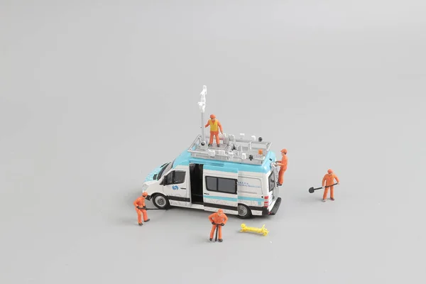 Fun of tiny weather van with worker — Stock Photo, Image