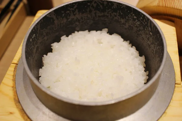 Cooked rice grains in stone bowl at japan — Stock Photo, Image