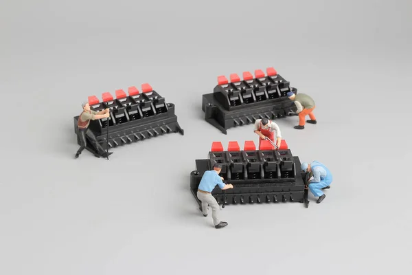 Mini Technicians working on fun setting — Stock Photo, Image