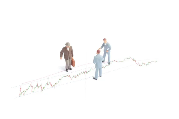 Povos de negócios no gráfico econômico falando — Fotografia de Stock