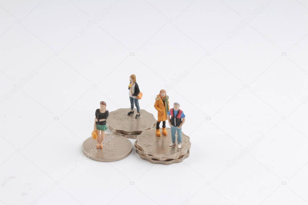  min figure standing on top of stack of coins