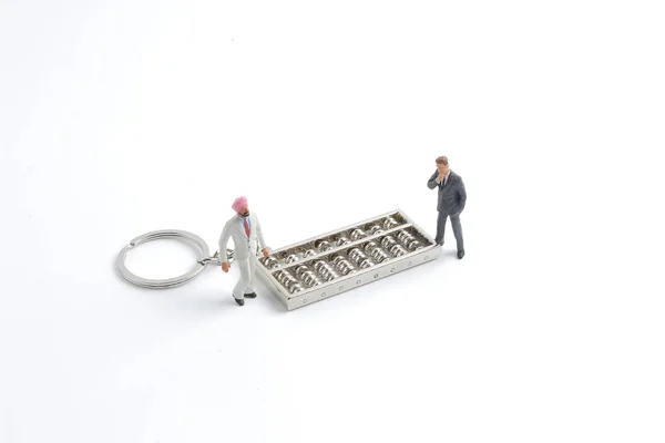 De mini van zakendoen met de abacus — Stockfoto