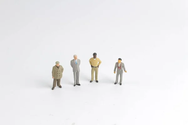 Mini gruppo modello di investitori in piedi insieme — Foto Stock