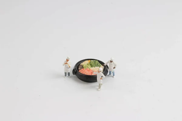 Min cook figuur met de pot Sukiyaki — Stockfoto