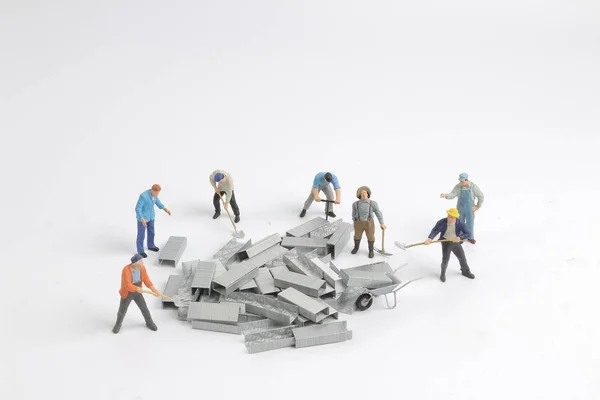 Fun of small figure move the iron — Stock Photo, Image