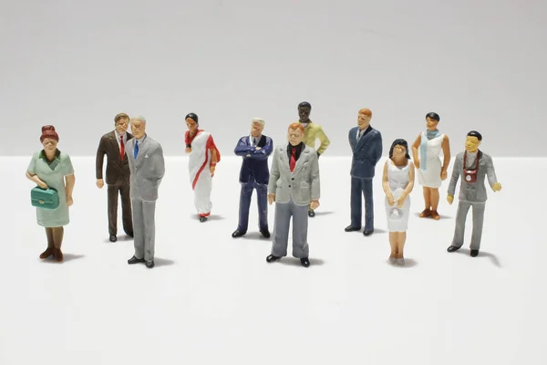 Mini figure di business su sfondo bianco — Foto Stock