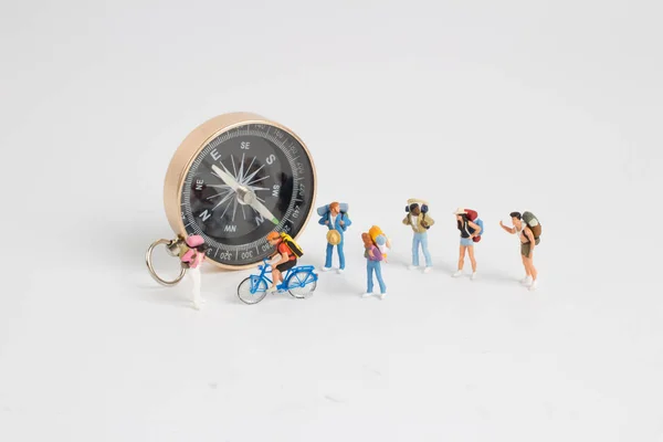 Compass withe the mini figure to tavel — Stock Photo, Image