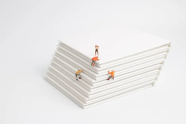 The mini of figure climb the book — Stock Photo, Image