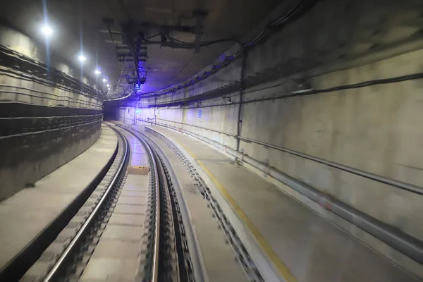 train moving  rail tunnel with moderate motion blur