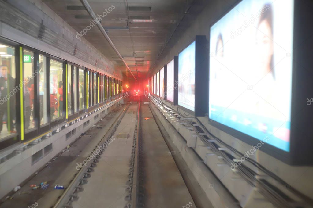 train moving  rail tunnel with moderate motion blur