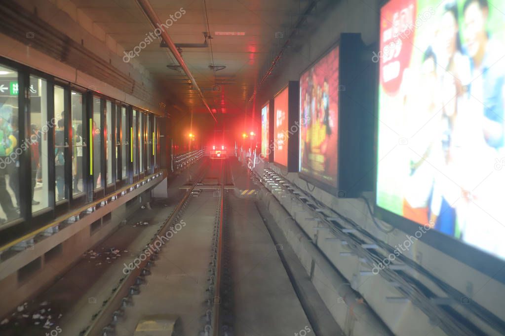 train moving  rail tunnel with moderate motion blur